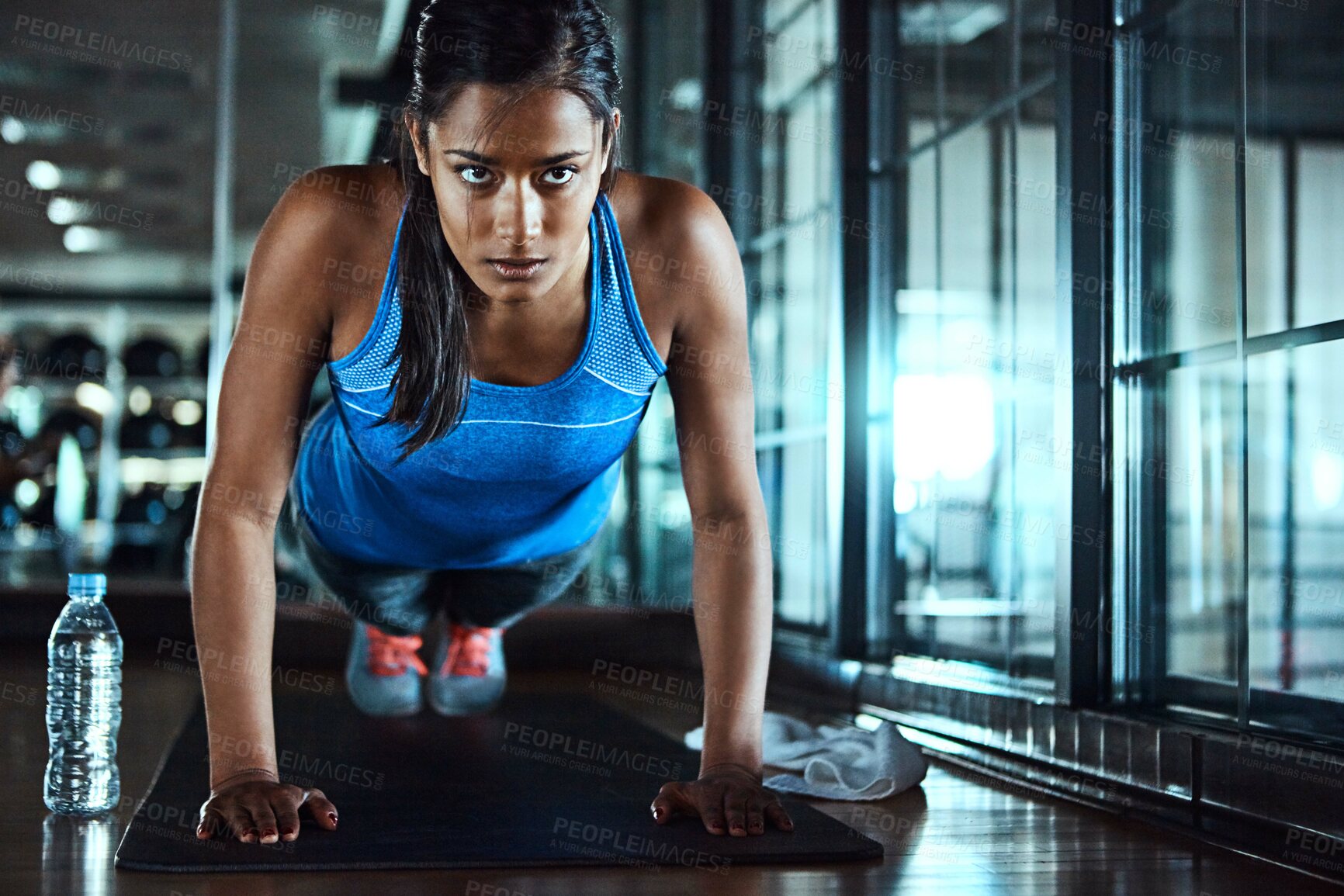 Buy stock photo Health, push up and woman in gym for workout with strength, wellness and arms training. Serious, fitness and female athlete with exercise for body goals for muscles and power in sports center.