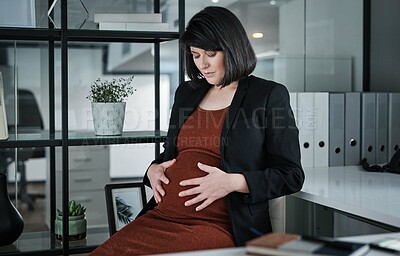 Buy stock photo Business woman, pregnant and office with stomach for maternity, motherhood or expecting. Female person, employee or pregnancy with tummy for commitment, childcare or support by desk at workplace