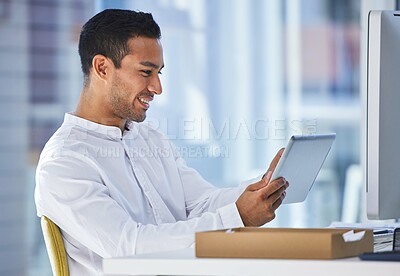 Buy stock photo App, smile and tablet with business man at desk in office for administration, research or report. Email, social media and technology with happy young employee in workplace for online planning