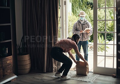 Buy stock photo Delivery man, package and woman with mask for logistics, shipping distribution or dispatch service. Covid, female person and courier with tablet for online shopping, compliance and safety in home