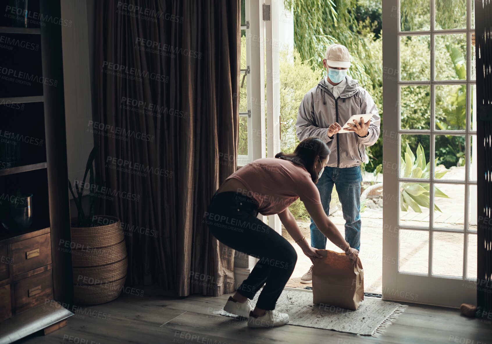 Buy stock photo Delivery man, package and woman with mask for logistics, shipping distribution or dispatch service. Covid, female person and courier with tablet for online shopping, compliance and safety in home
