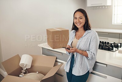 Buy stock photo Portrait, Asian woman and happy in home with boxes for unpacking, satisfied and confident with ownership. Real Estate, smile and furniture in kitchen with smartphone for communication and moving in
