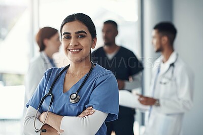 Buy stock photo Portrait, nurse and happy woman with arms crossed in hospital for healthcare career, wellness or proud doctor. Face, smile and confident medical professional surgeon, expert or coworking employee
