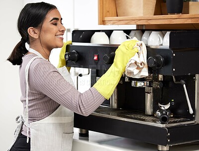Buy stock photo Barista, smile and wipe coffee machine in coffee shop, deli and cafe for sanitation, cleansing and dusting. Happy, woman and polish espresso maker in diner, bakery and restaurant for routine clean