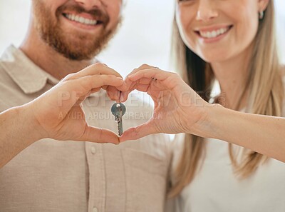 Buy stock photo Excited, couple and key with heart hands for new house for moving in or relocating for real estate for relationship. Woman, man and happy in together for apartment, home or property as married people