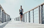 Fitness, exercise and running with black woman on bridge with morning workout for sports, health and wellness. Motivation, freedom and energy with runner training for marathon, goals and vision 