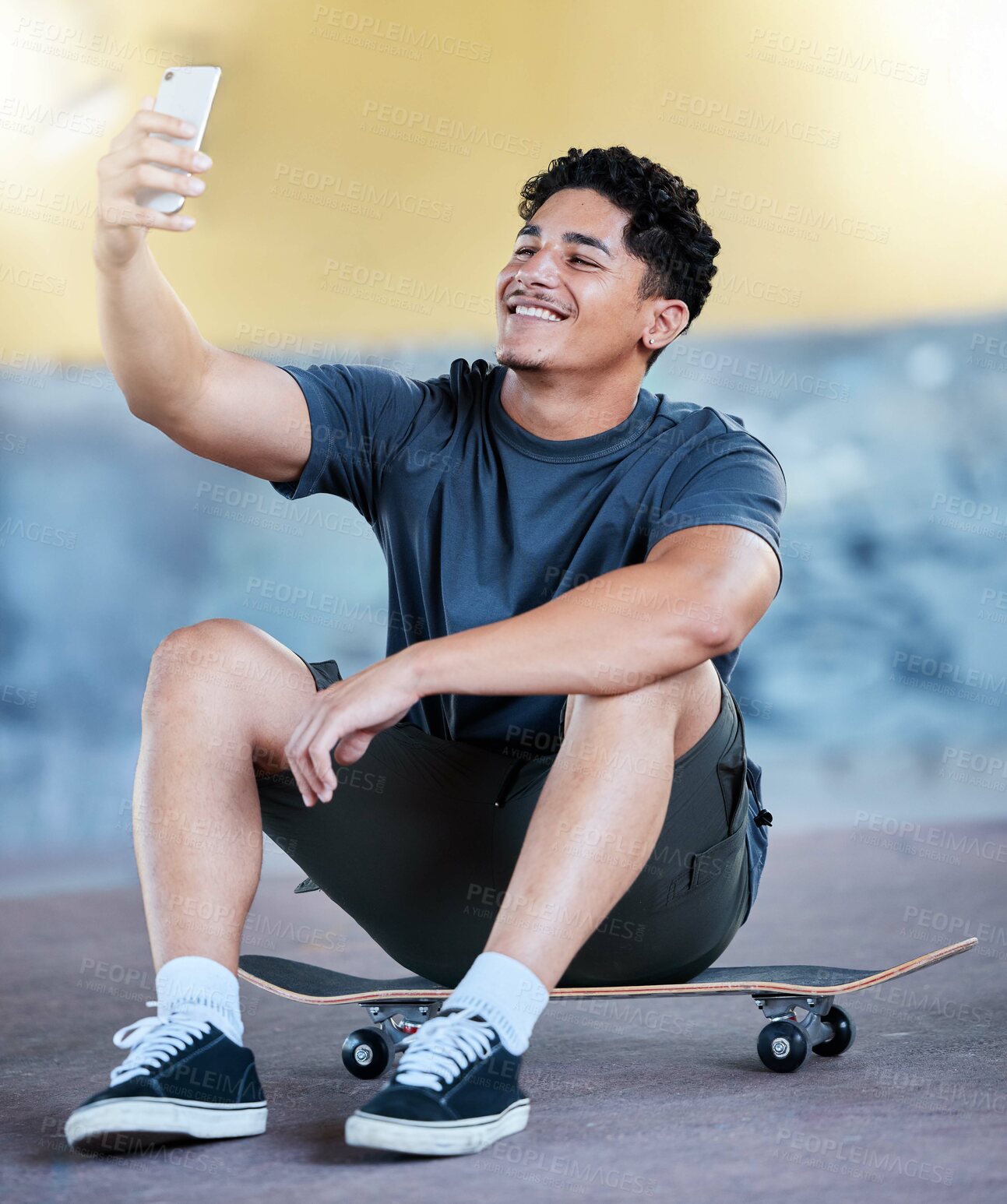 Buy stock photo Skateboard, selfie and man outdoor at an urban skate park for exercise, training and fun while taking a profile picture for social media. Gen z, skating and sports motivation content on a smartphone