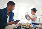 Plane ticket, luggage and home with excited family and holiday suitcase with dad and child. House, bag and helping in a bedroom for vacation and journey with father and kid together with a smile