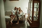 Family, newborn and bonding in living room, relax on couch and love with care with man and woman with newborn. Growth, happiness and calm, people at home with new infant, together and early childhood