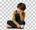 One asian boy looking sad and depressed while sitting on the floor and posing against orange copyspace background. Cute mixed race child with ADD looking bored and depressed