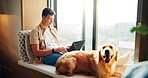 Man, laptop and dog on couch in home, window and remote work with reading, review and feedback for project. Person, writer and pet golden retriever with typing, editing and creativity at apartment
