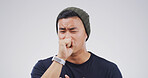 Man, cough and sick student in studio with chest pain, allergies or respiratory virus on white background. Person, asthma or lung disease with fatigue, sore throat and cover mouth for infection
