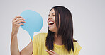 Woman, laugh and point with speech bubble, studio or choice with mockup space by white background. Excited person, happy and poster for opinion, announcement or decision with sign for social media