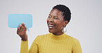 Black woman, laugh and happy with speech bubble, studio and mock up space by white background. African person, smile and poster for opinion, announcement and choice with blank sign for social media