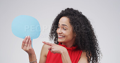 Buy stock photo Pointing, speech bubble and woman in studio, feedback and announcement on white background. Person, social media and chatting poster with gesture, communication and coming soon with voice review