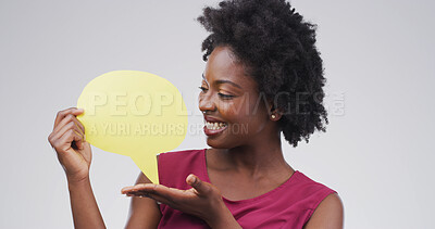Buy stock photo Happy, woman and speech bubble with announcement in studio for sale, discount deal and show FAQ. Black person, ambassador and mockup poster on white background for advertising news and about us space