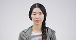 Serious, woman and portrait of student in studio with confidence for university education. Pride, college and face of Asian female person with knowledge, lesson or studying by white background.