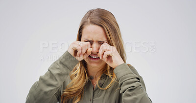 Buy stock photo Depression, crying and woman in studio with anxiety, sad and stress with trauma on white background. Grief, unhappy person and tears for mental health crisis, disaster or mourning with emotional pain