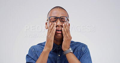 Buy stock photo Sad, black man and crying with sorrow in studio of bad news, mourning loss and emotional breakdown. Male person, glasses and grief for trauma memory, heart broken and panic attack on white background
