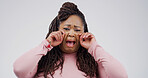 Sad, black woman or portrait with cry for emotional breakup on a white studio background. Female person, tears and model with sob, stress or expression for divorce, mental health or bad news on space