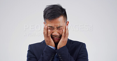 Buy stock photo Crying, upset and businessman in studio with stress for unemployment, burnout or mistake. Emotions, frustration and male corporate employee with tears for loss of job or fail by white background.