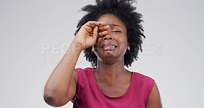 Buy stock photo Black woman, crying and sad in studio with depression, grief or loss with emotion on white background. Space, tears and crisis with male person in mourning, distress with mental health and unhappy