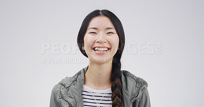 Buy stock photo Laughing, smile and portrait of woman in studio with mockup space for comedy joke with humor. Goofy, happy and Japanese female person with giggle for funny, gossip or silly comic by white background.