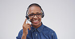 Portrait, telemarketing and black man in studio, speaking and help desk on white background. Customer support, employee or person with headset, contact us or online consultation with friendly service