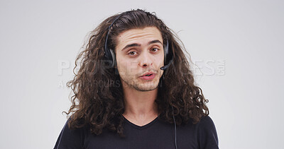 Buy stock photo Portrait, telemarketing and man in studio, speaking and customer service on white background. Business, employee and person with headset, contact us and online consultation with telecom sales