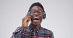 Portrait, black man and headset at call centre in studio for consultation, funny client and contact us. Agent, laugh and mic for customer service, advice and listen to comic joke on white background