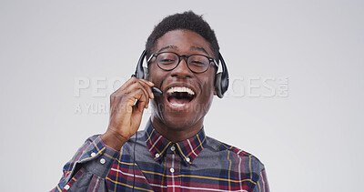 Buy stock photo Portrait, black man and headset at call centre in studio for consultation, funny client and contact us. Agent, laugh and mic for customer service, advice and listen to comic joke on white background