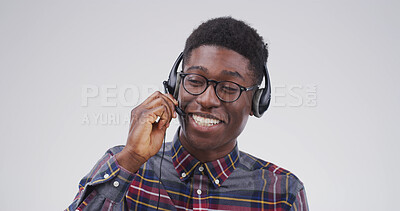 Buy stock photo Black man, laugh and headset at call centre in studio for consultation, funny client and contact us. Smile, agent and mic for customer service, advice and listening to comic joke on white background