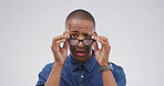 Portrait, black man and shocked with glasses in studio for fake news, bad rumor and gossip fail. Male person, space and reaction to horror story, danger risk and revelation secret on white background