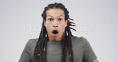 Buy stock photo Surprise, portrait and shocked man in studio with face expression, bad news or announcement. Rastafarian, surprise and mouth open for gossip, drama and feedback or review of fail on white background