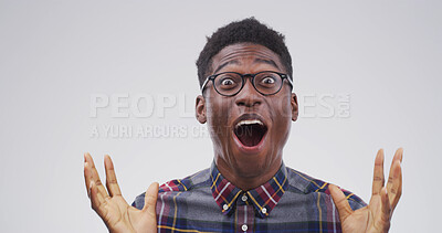 Buy stock photo Happy, black man and portrait with shock or emotion for winning in studio on a white background. Excited, male person or African model with surprise for good news, promotion or lucky winner on space