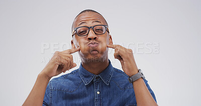 Buy stock photo Silly, crazy and portrait of black man in studio with funny face for playful, comedy and humor on white background. Mockup space, emoji and African person with goofy, quirky and facial expression