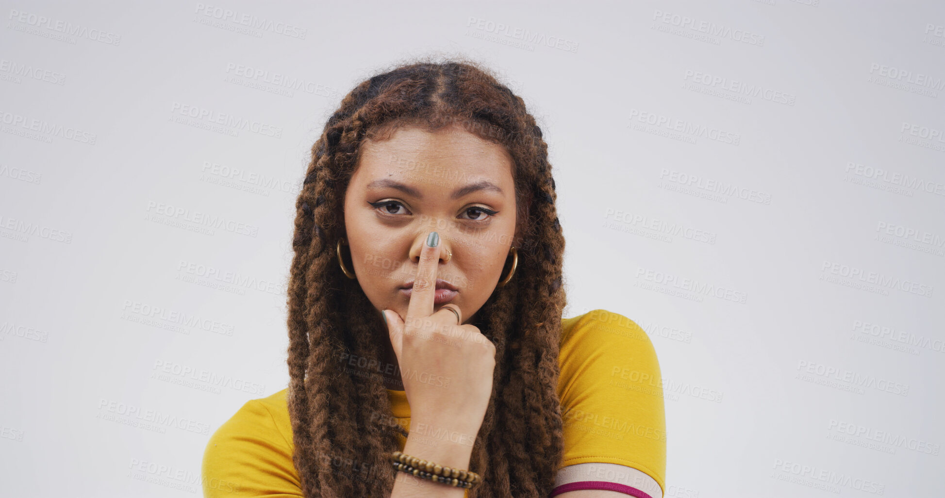 Buy stock photo Touch nose, silly and portrait of woman in studio for funny face, humor and comedy on white background. Serious, mockup space and isolated person with reaction, facial expression and emoji for joke