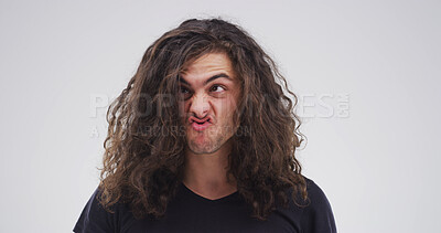 Buy stock photo Silly, crazy and man in studio with funny face for playful, comedy and humor on white background. Mockup space, emoji and isolated person with goofy, quirky and facial expression for comic reaction