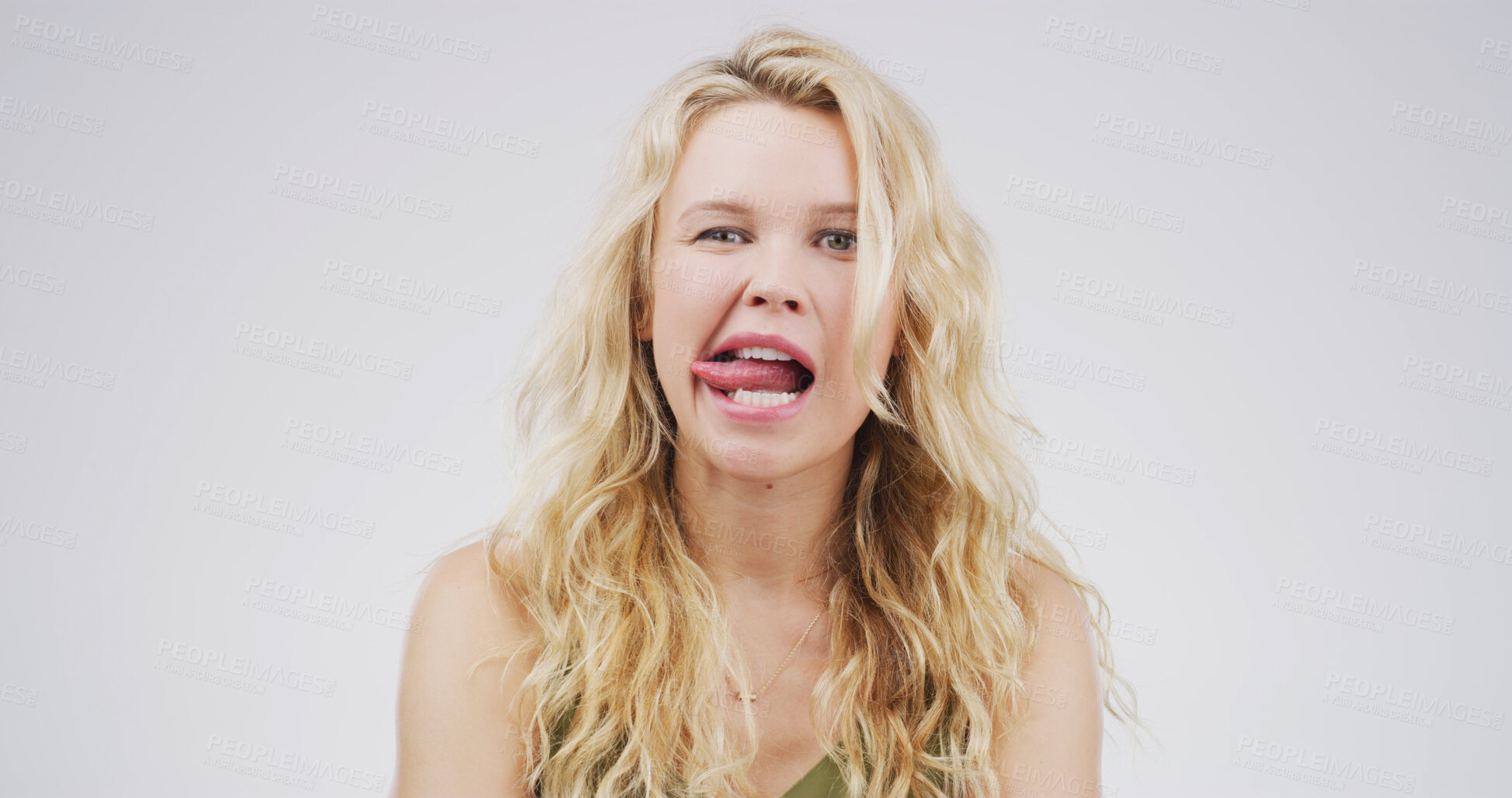 Buy stock photo Portrait, funny face and woman with facial expression, studio or playful for comedy, humor or comic. White background, quirky and person with reaction for personality, goofy and silly with gesture