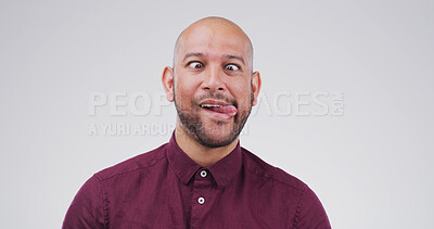 Buy stock photo Silly, cross eyes and man in studio with funny face for playful, comedy and humor on white background. Mockup space, emoji and person with goofy, quirky and facial expression for crazy reaction