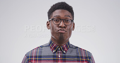 Buy stock photo Comic, funny face and pout with black man on studio space for emotions, humor or silly joke. Comedy, emoji and glasses with goofy person isolated on white background for crazy or quirky reaction