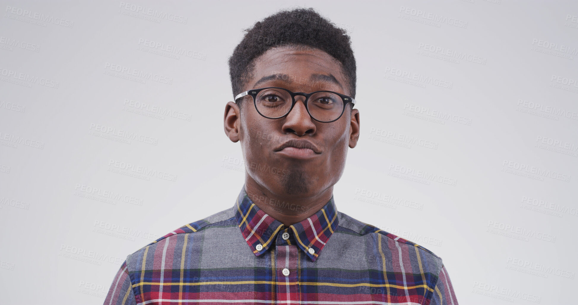 Buy stock photo Comic, funny face and pout with black man on studio space for emotions, humor or silly joke. Comedy, emoji and glasses with goofy person isolated on white background for crazy or quirky reaction