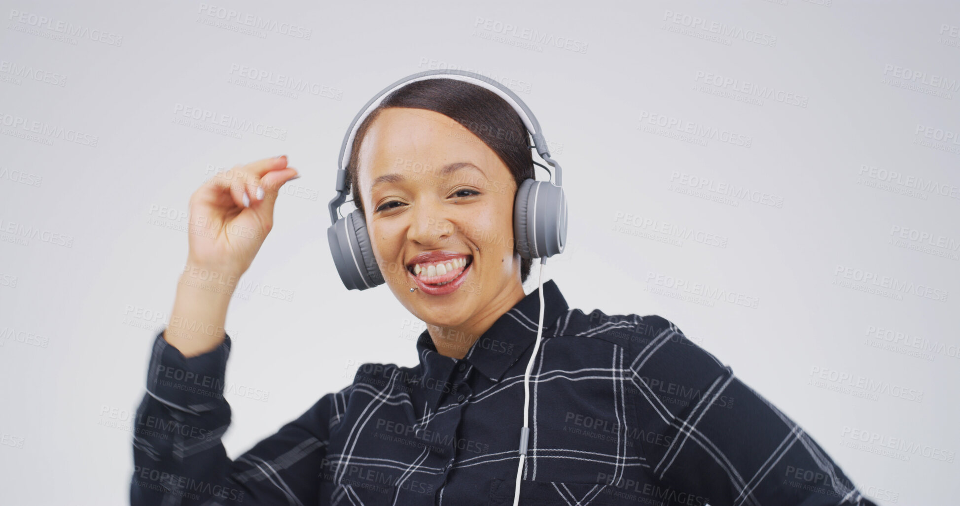 Buy stock photo Woman, portrait and dancing with headphones in studio for music playlist, streaming radio or rhythm. Happy, person and technology on white background for listening to sound track, energy and mockup