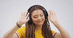 Woman, headphones and happy with dancing in studio with album, streaming or song on white background. African person, smile and listen to music with subscription, radio and audio tech with rhythm