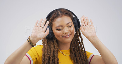 Buy stock photo Woman, headphones and happy with dancing in studio with album, streaming or song on white background. African person, smile and listen to music with subscription, radio and audio tech with rhythm