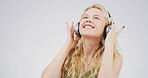 Woman, headphones and smile in studio with sound, digital streaming and memory on white background. Person, happy and listen to music, radio and audio subscription with mock up space for song