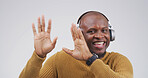 Black man, dancing with headphones in studio portrait with smile, streaming or song on white background. African person, happy and listen to music with subscription, radio and rhythm in Nigeria