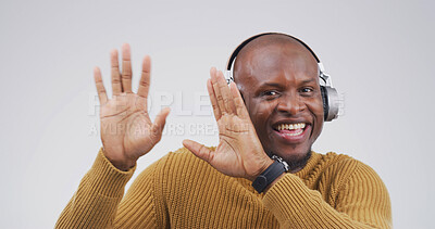 Buy stock photo Black man, dancing with headphones in studio portrait with smile, streaming or song on white background. African person, happy and listen to music with subscription, radio and rhythm in Nigeria