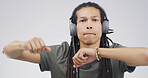Man, portrait and dancing with headphones in studio for music playlist, streaming audio and rhythm. Space, person and technology on white background for listening to sound track, energy and movement
