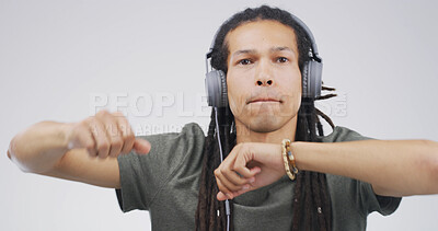 Buy stock photo Man, portrait and dancing with headphones in studio for music playlist, streaming audio and rhythm. Space, person and technology on white background for listening to sound track, energy and movement